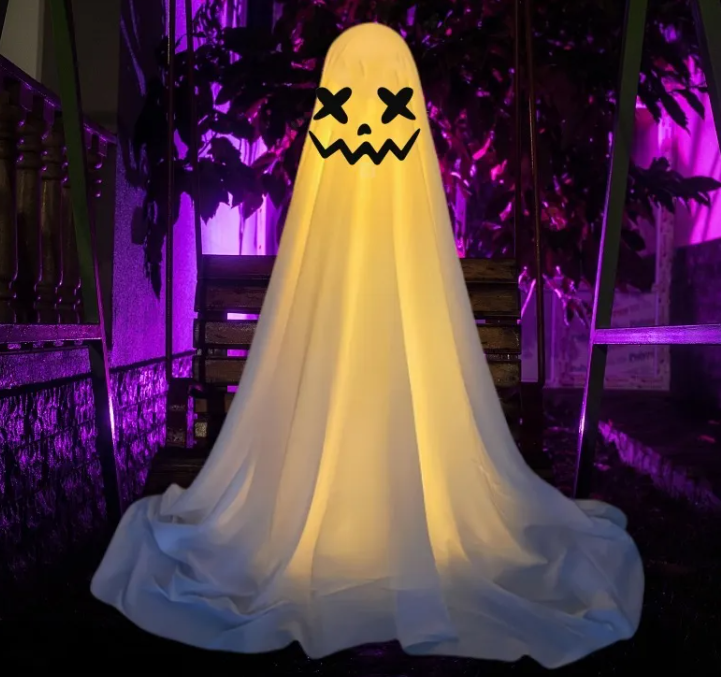 Glowing ghost decoration at night